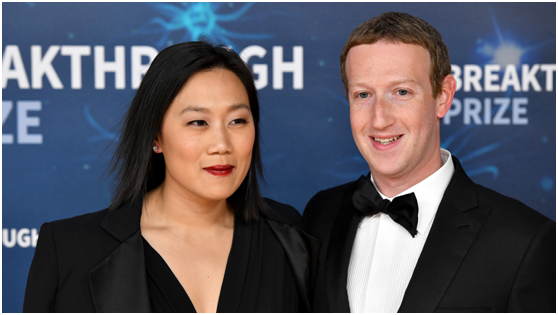 扎克伯格(右)和妻子普莉希拉·陈 资料图